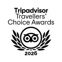Logo del premio Tripadvisor Travellers' Choice 2026 con corona di alloro stilizzata.